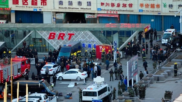 Police and emergency personnel gather outside the railway station