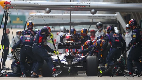 Daniel Ricciardo and Red Bull Racing make a pit stop during the Chinese Formula One Grand Prix