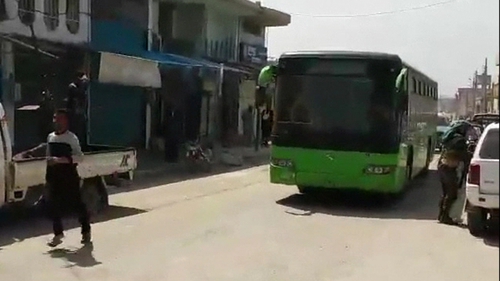 Buses left the besieged city with rebel fighters on board