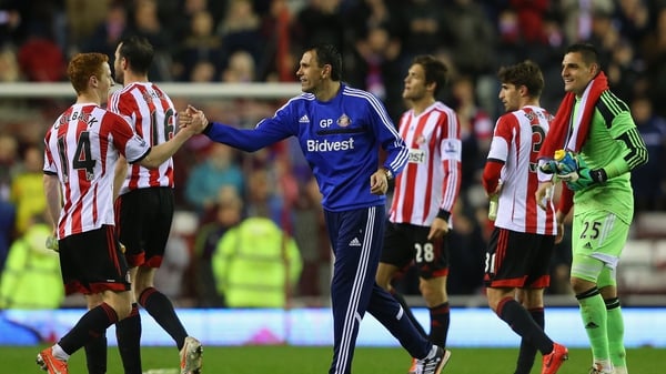 Gus Poyet celebrates with Jack Colback and his players after Sunderland seal safety with a win over West Brom