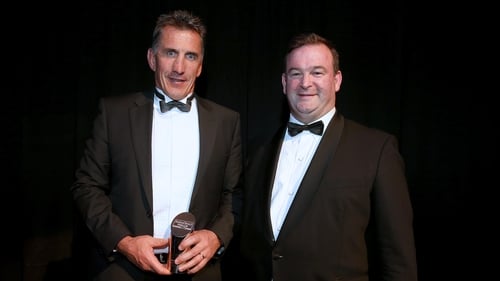 Munster's Rob Penney is presented with his award by of RaboDirect PRO12 CEO John Feehan