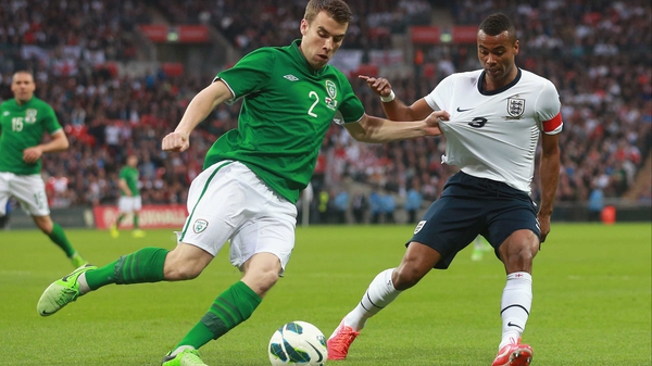 Ashley Cole (R) in action against Ireland's Seamus Coleman