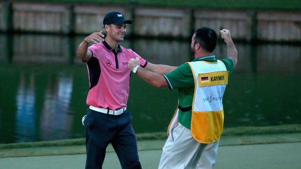 Martin Kaymer celebrates victory with his caddy