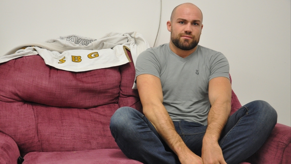 Cathal Pendred sits cross-legged in the changing rooms of his gym in West Dublin