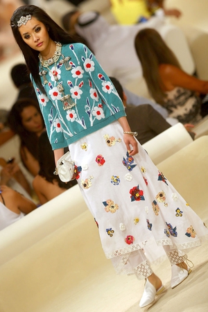 A model walks the runway at the Chanel Cruise Collection 2014/2015 at The Island in Dubai, United Arab Emirates.