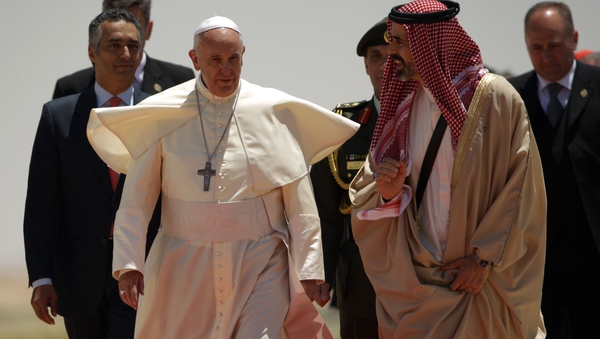 The pontiff is greeted by Jordan's Prince Ghazi bin Mohammed on the first day of his visit to the Middle East