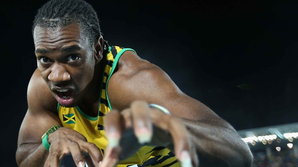Yohan Blake poses after breaking the world record for the 4x200 metres