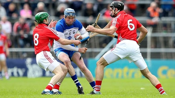 Austin Gleeson of Waterford is challenged by two Cork players