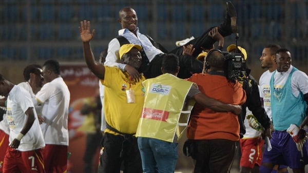 Ghana coach Kwesi Appiah celebrates with his team after beating Egypt to qualify for the 2014 World Cup