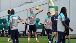 Cristiano Ronaldo plays with a ball tied to a goal post during training in Florham Park, New Jersey
