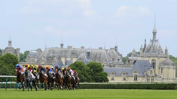 The Chateau de Chantilly looms large in the background at the pretty French racecourse