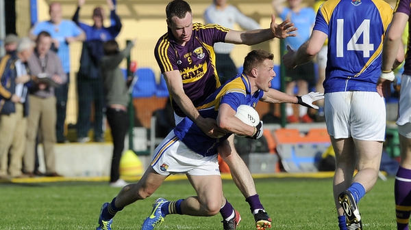 Longford’s Shane Doyle is fouled by Paddy Byrne of Wexford