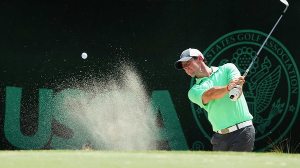 Rory McIlroy hits a shot from a bunker on the practice range at Pinehurst