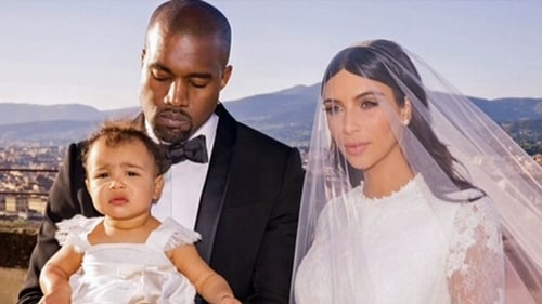 North with her parents Kim and Kanye on their wedding day