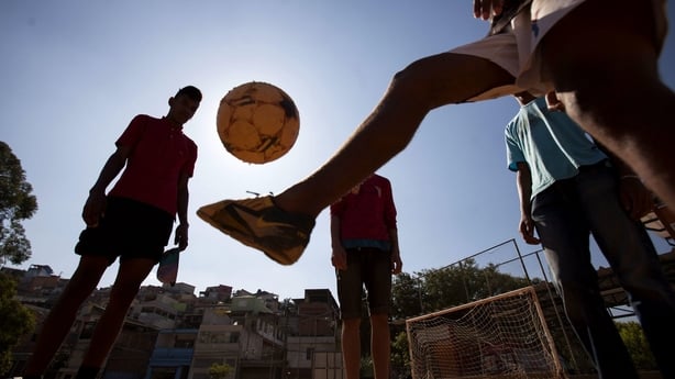 Playing football in Brasilandia favela