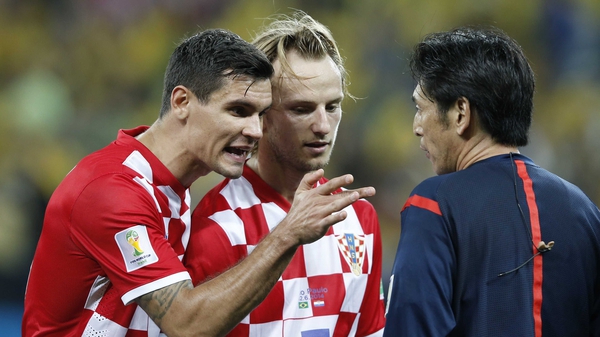 Ivan Rakitic (R) limped out of the win against Spain