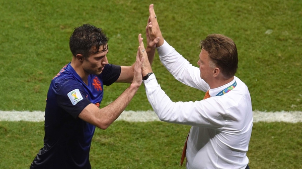 Robin van Persie (L) celebrates with Dutch coach Louis van Gaal