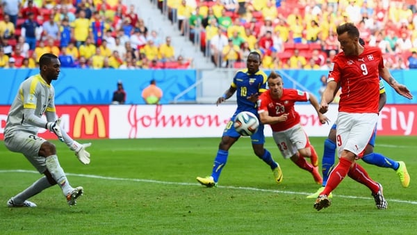 Haris Seferovic smashes home the winner past Alexander Dominguez in the Ecuador goal