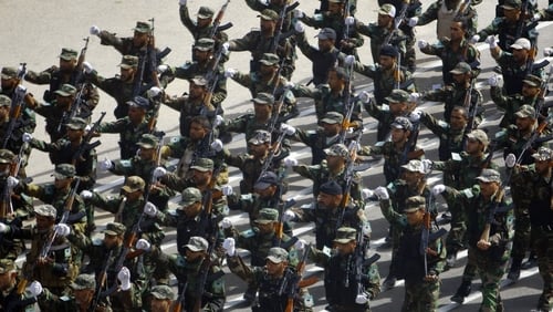Newly-recruited Iraqi army volunteers take part in a military parade in the shrine city of Najaf, in central Iraq