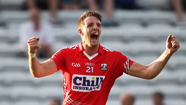 Cork's Aidan Walsh celebrates scoring a point during the final moments of the match