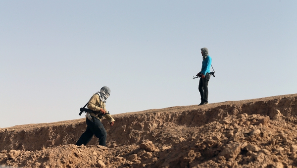 Iraqi Shia Turkmen patrol close to locations of jihadist ISIS fighters in northern Iraq