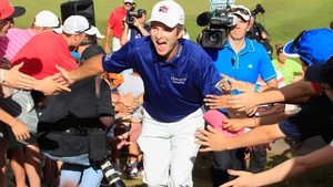 Kevin Streelman celebrates with fans after winning the Travelers Championship