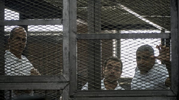 Peter Greste (L), Baher Mohamed (C) and Mohamed Fadel Fahmy (R) were jailed yesterday