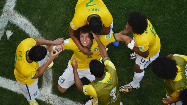 Brazil celebrate their opening goal