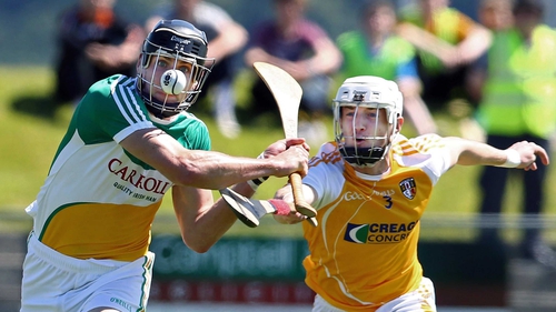 Antrim's Conor McKinley attempts to hook Offaly's Conor Mahon