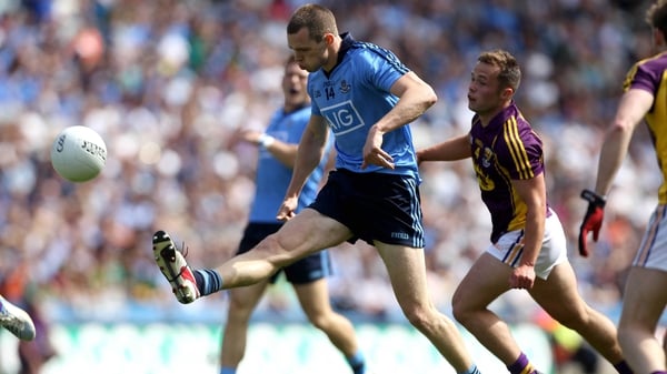 Dublin's Dean Rock under pressure from Conor Carty of Wexford