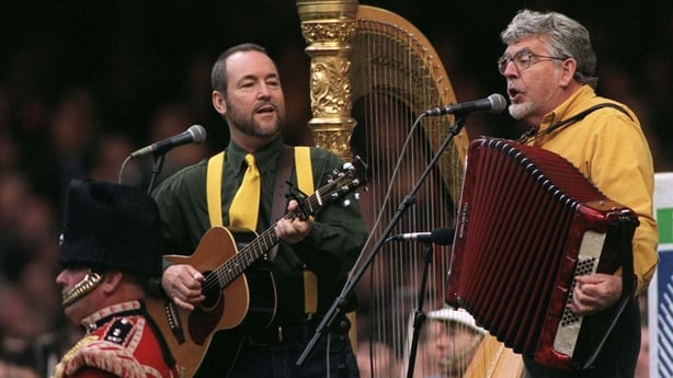 Rolf Harris plays accordion
