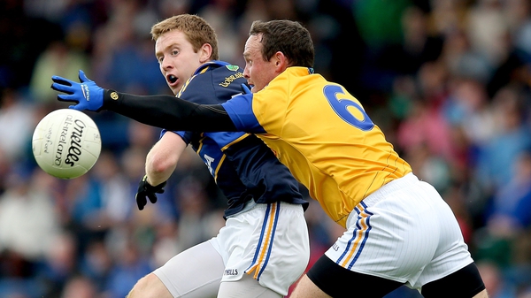 Tipperary's Brian Fox (L) does battle with Enda Williams of Longford