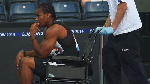 Yohan Blake is is wheeled off in a wheelchair after pulling up in the Sainsbury's Glasgow Grand Prix 100m final with a hamstring injury