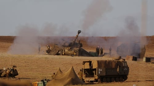 An Israeli unit fires towards targets in Gaza
