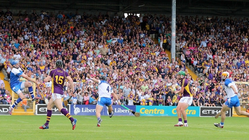 Conor McDonald beats Stephen O'Keeffe for a Wexford goal