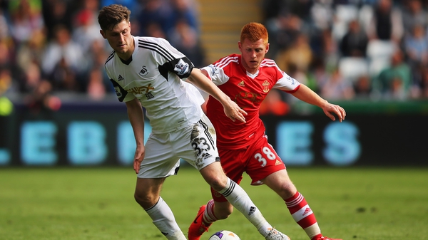 Ben Davies (left) in action for Swansea City