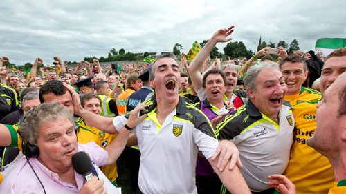 Donegal manager Jim McGuinness celebrates with players