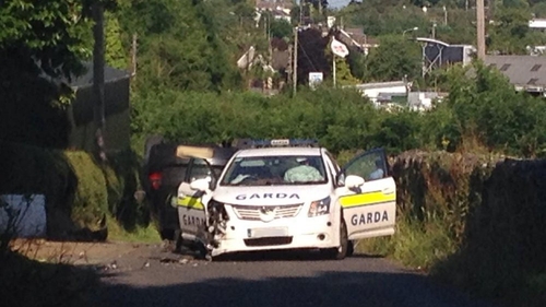 Garda car was on the driver's side by another car, which then overturned