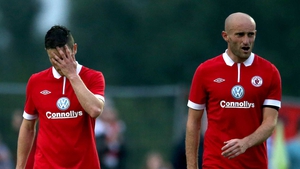Sligo stars John Russell and Alan Keane cut dejected figures after the defeat to Rosenborg