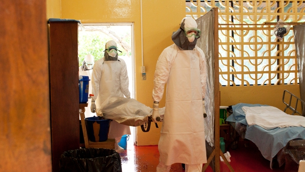 Kent Brantly (right) working at the clinic in Liberia