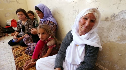Thousands of Yazidi families have fled violence in the northern Iraqi town of Sinjar