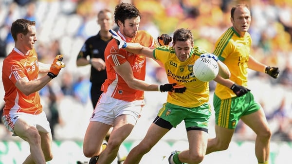 Donegal's Odhran Mac Niallais holds off the Armagh defence