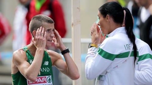 Rob Heffernan with his coach and wife Marian Heffernan after withdrawing from the 50km walk