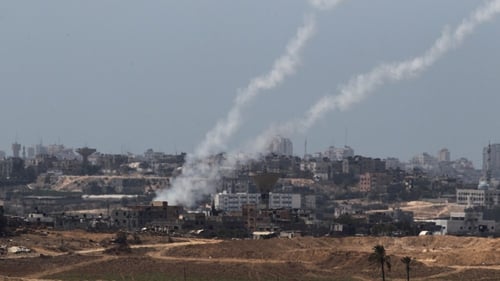 A picture taken from the Israeli side of the Israel-Gaza Border on shows rockets being fired by Palestinian militants from Gaza into Israel