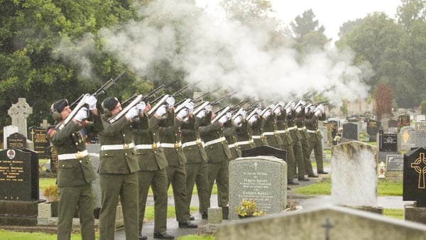 Members of the Defence Forces take part in a military salute at Mr Reynolds's graveside (Pic: Merrion Street)