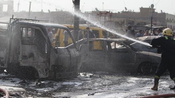 A car bomb ripped through a crowded Baghdad intersection during morning rush hour