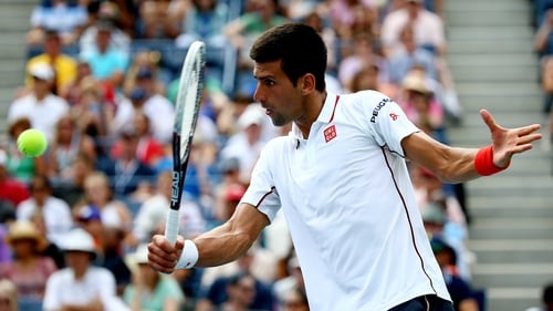 Novak Djokovic executes a volley in his win over Sam Querrey at Flushing Meadows