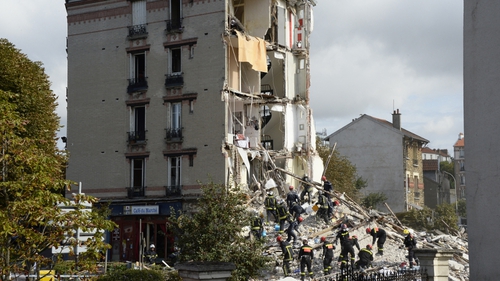 People were evacuated from the rubble of the building in a Paris suburb