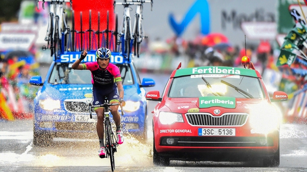 Winner Anacona punches the air as he comes home in splendid isolation on stage nine of the Vuelta