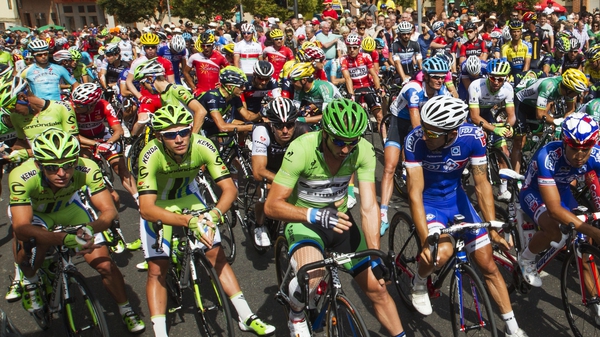 Cyclists wait for the start of the 13th stage of the 69th edition of La Vuelta